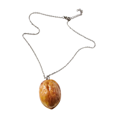 The Glam Bijoux walnut-inspired clay necklace, symbolic jewellery of protection and strength.