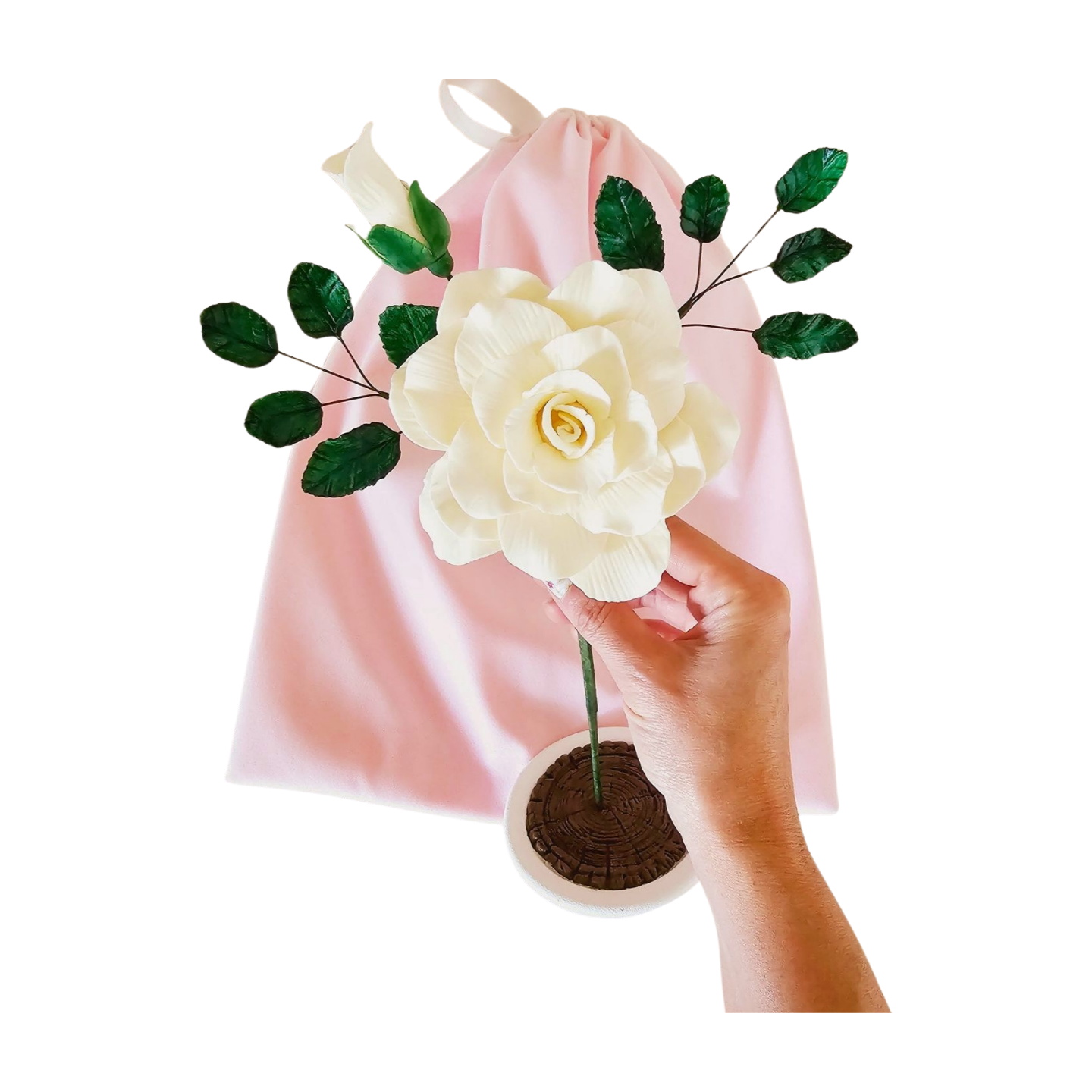 Elegant handmade clay tea rose in a glass holder, a timeless decorative piece