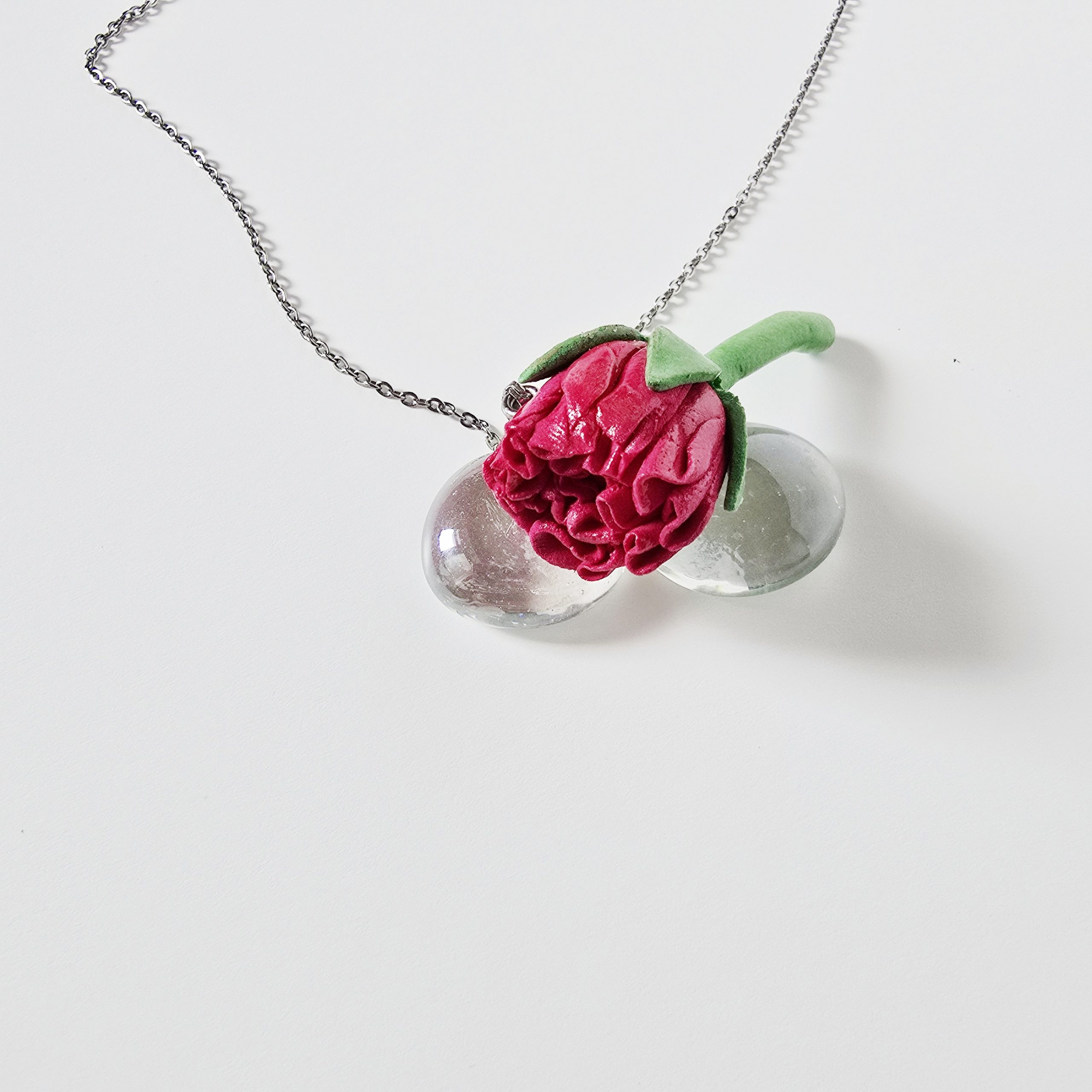 Handmade carnation necklace in clay by The Glam Bijoux on a hypoallergenic chain.