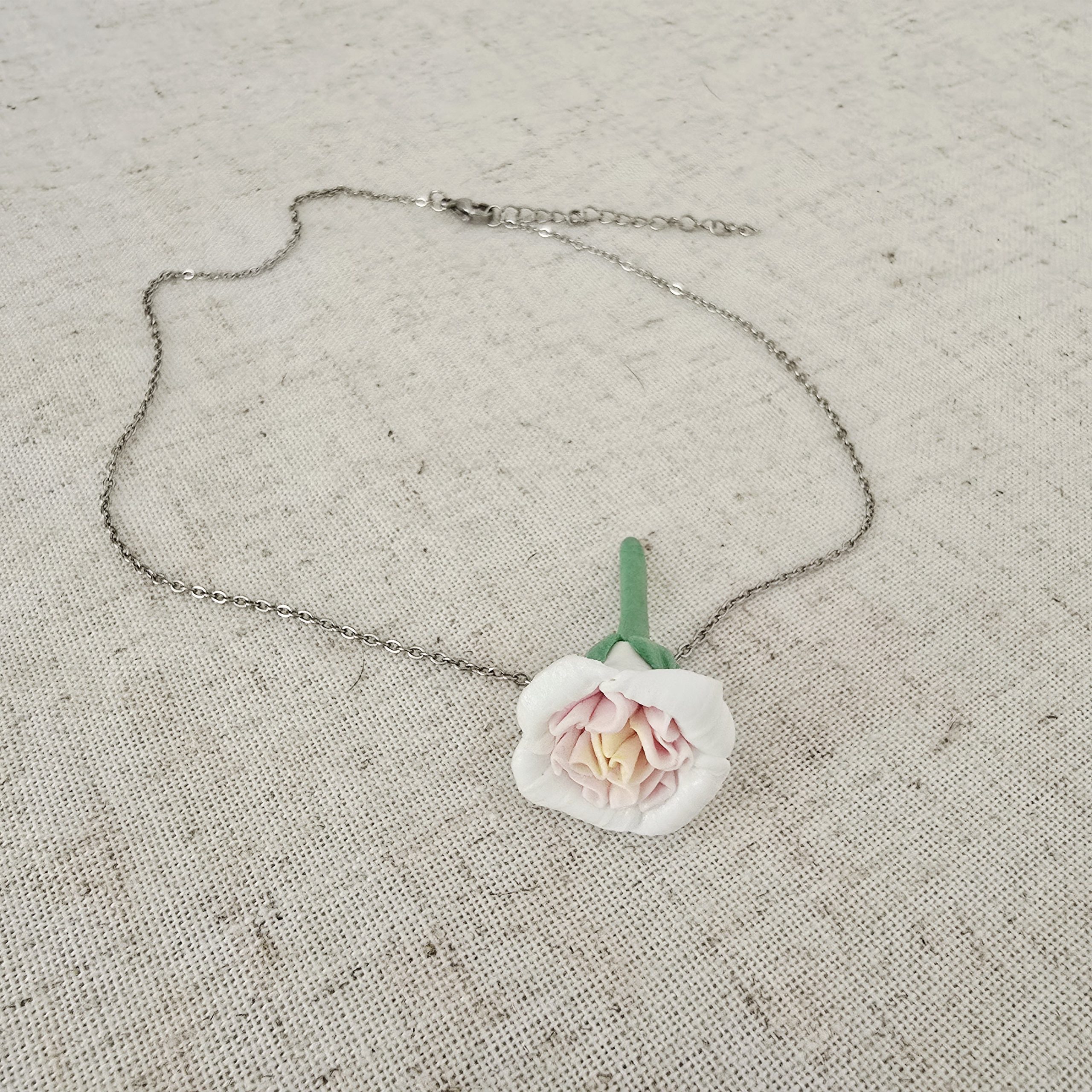 Close-up of handmade english garden rose necklace in clay by The Glam Bijoux.
