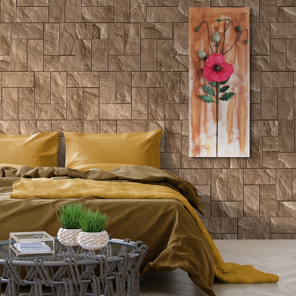 Unique clay poppy wall art above a beige sofa in a minimalist room with natural light.