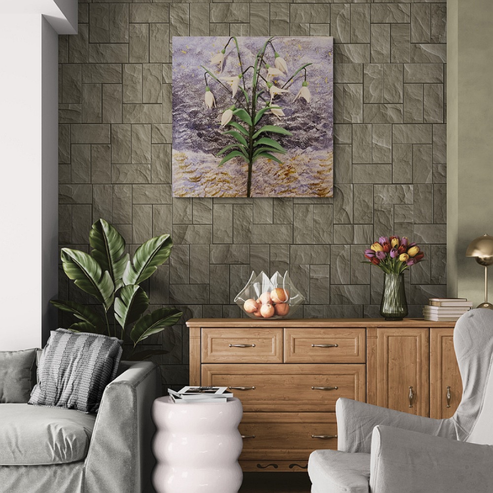 Clay snowdrop painting displayed in a cosy living room.