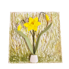 A complete view of Daffodil Dreamscape, featuring a bright yellow daffodil on a textured green and brown background.