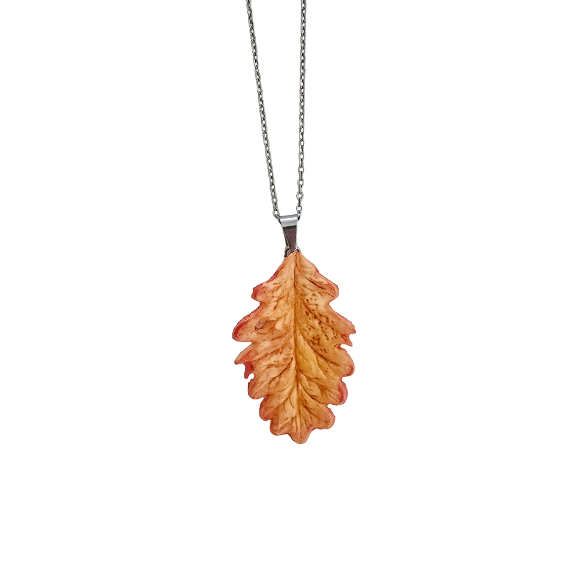 Oak leaf necklace — handmade air-dry clay pendant in woodland green on white background